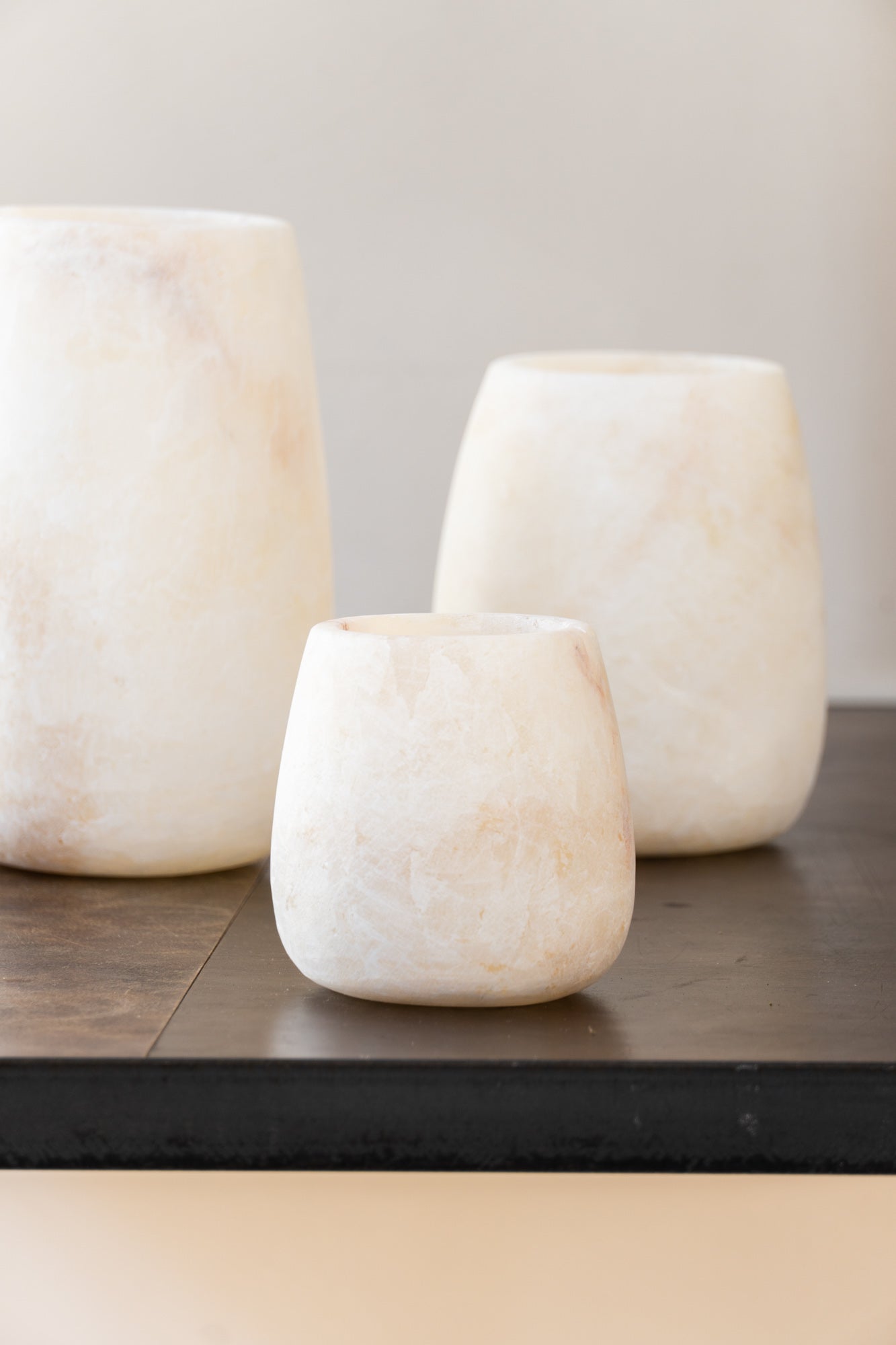 Close-up of the Alabaster Tea Light White Tear Drop Shape by The Loft Selects.