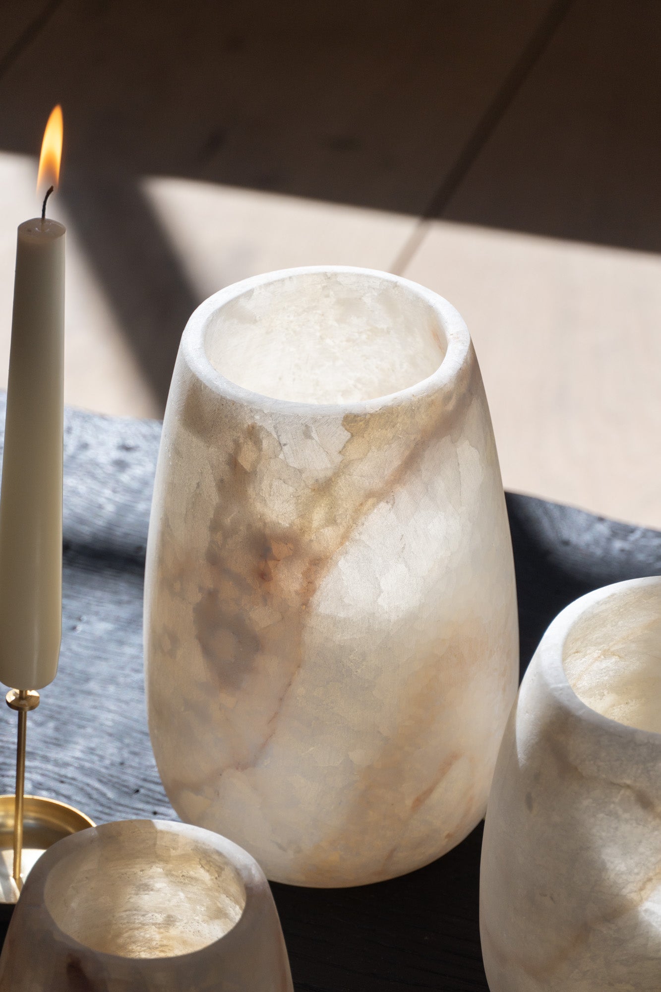 Details of the Alabaster Tea Light White Tear Drop Shape by The Loft Selects.