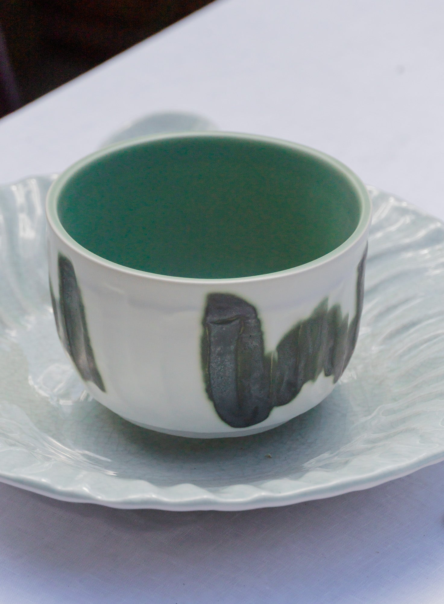 Dashi Bowl Green on plate by Jars Ceramistes.