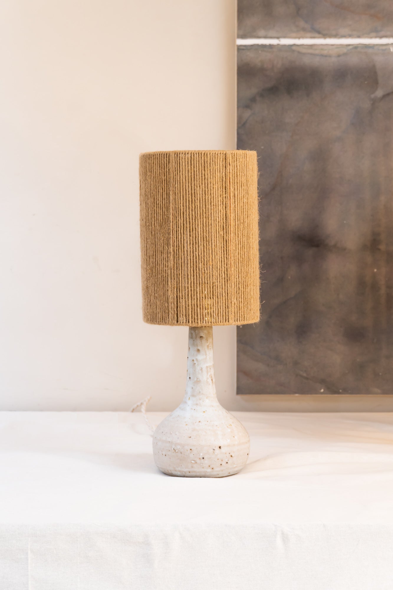 Small Lune lamp by Grès Ceramics - handmade ceramic smooth stone table lamp with jute rope shade