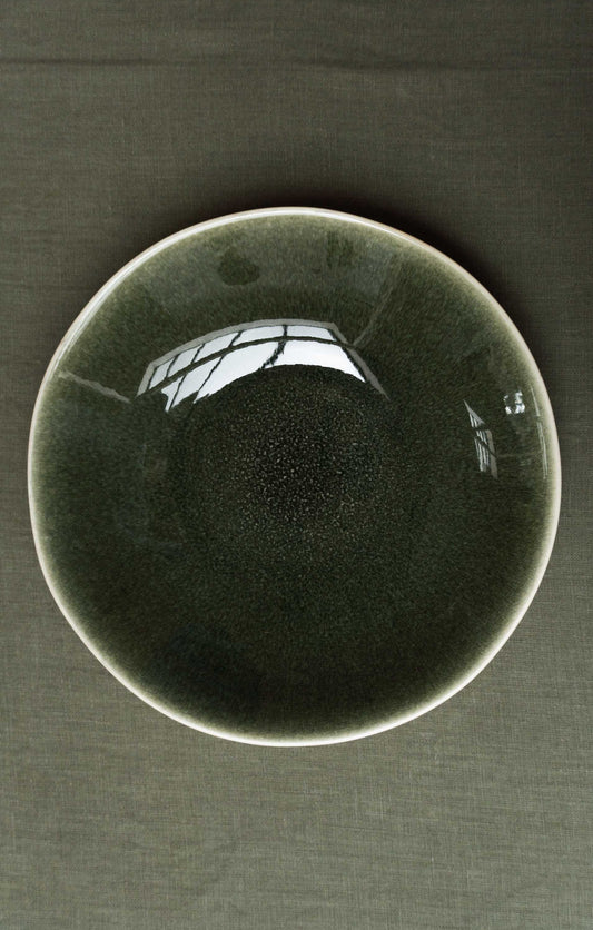 Top view of the Maguelone Deep Plate Forest Green by Jars Ceramistes.