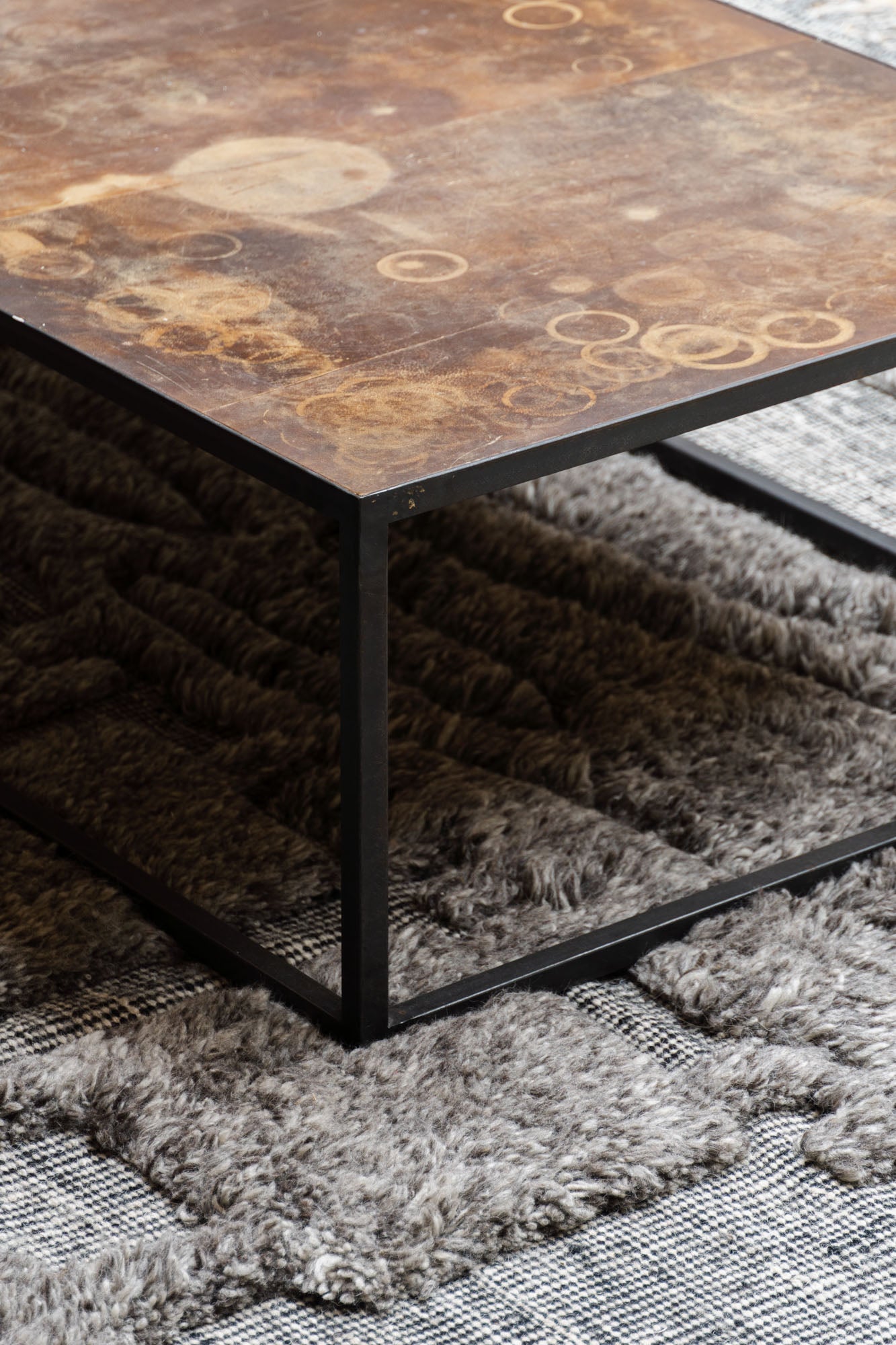 Close up of the Mesa Coffee Table by Heerenhuis set on a handwoven rug by Cappelen Dimyr.
