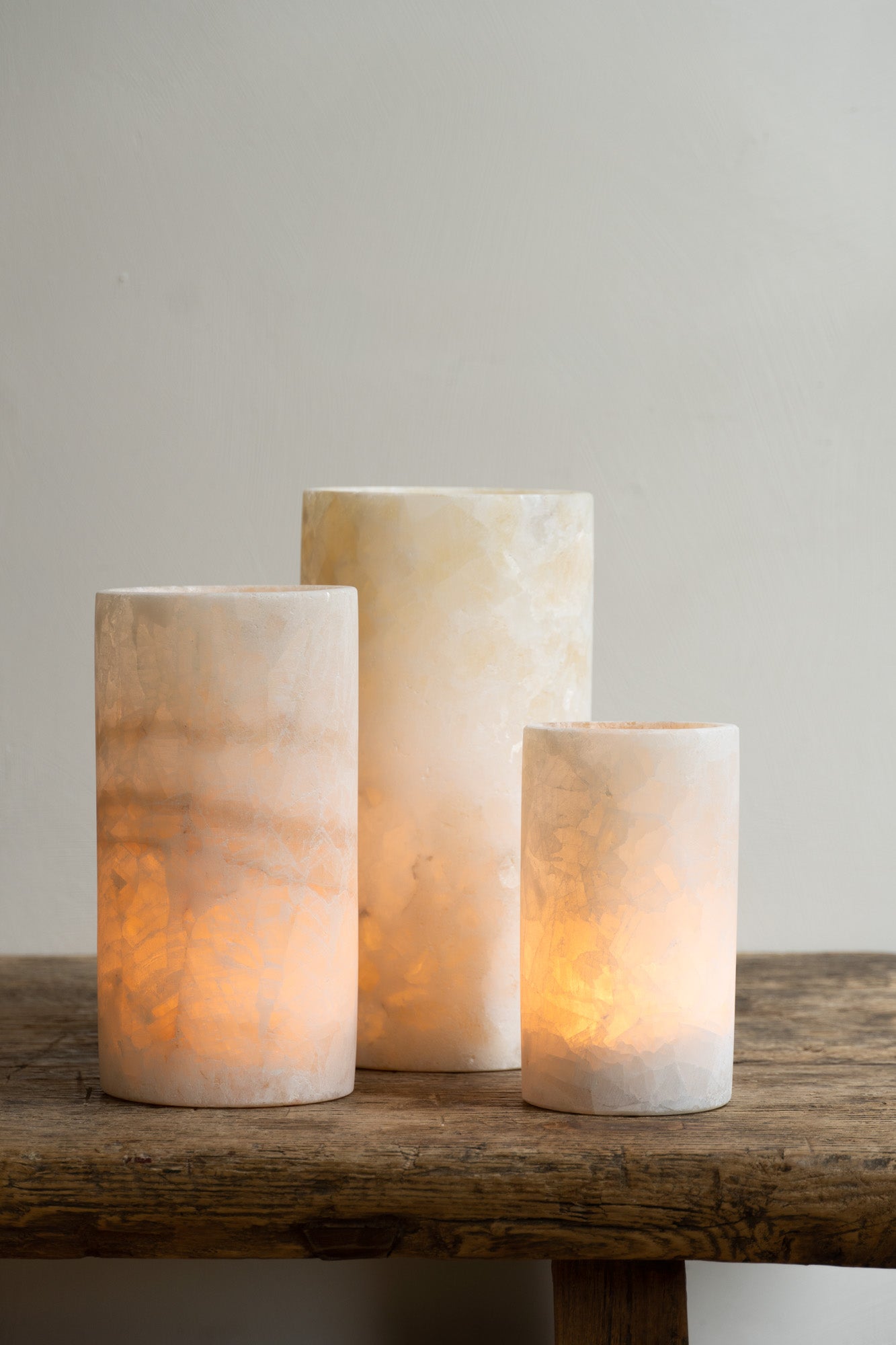 Three lit Alabaster Tealights in small, medium and large.