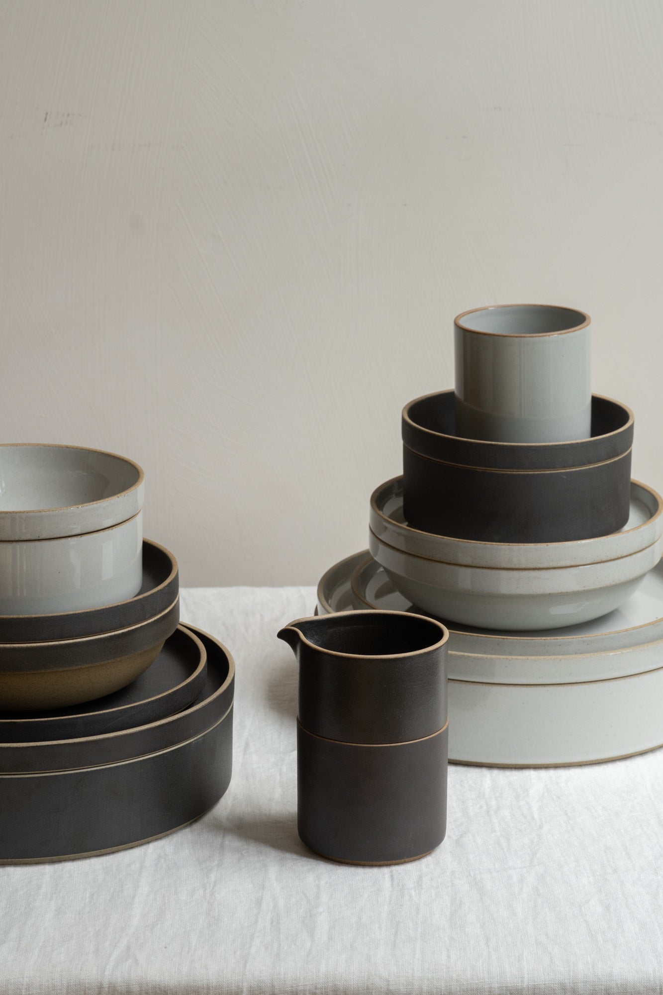 Hasami Porcelain tableware collection set in Grey and Black set on white linen table cloth.