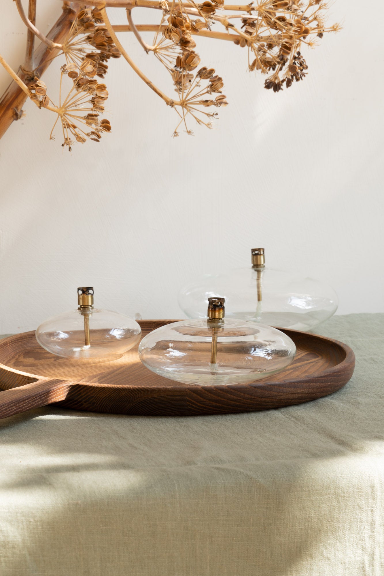 Ova Oil Lamps on wooden tray.