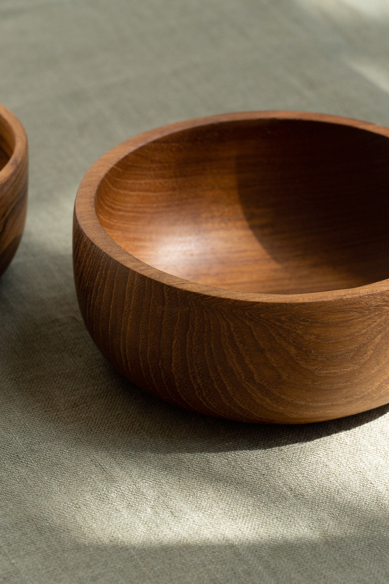 Close-up of the Nibble Wooden Bowl by The Loft Selects.
