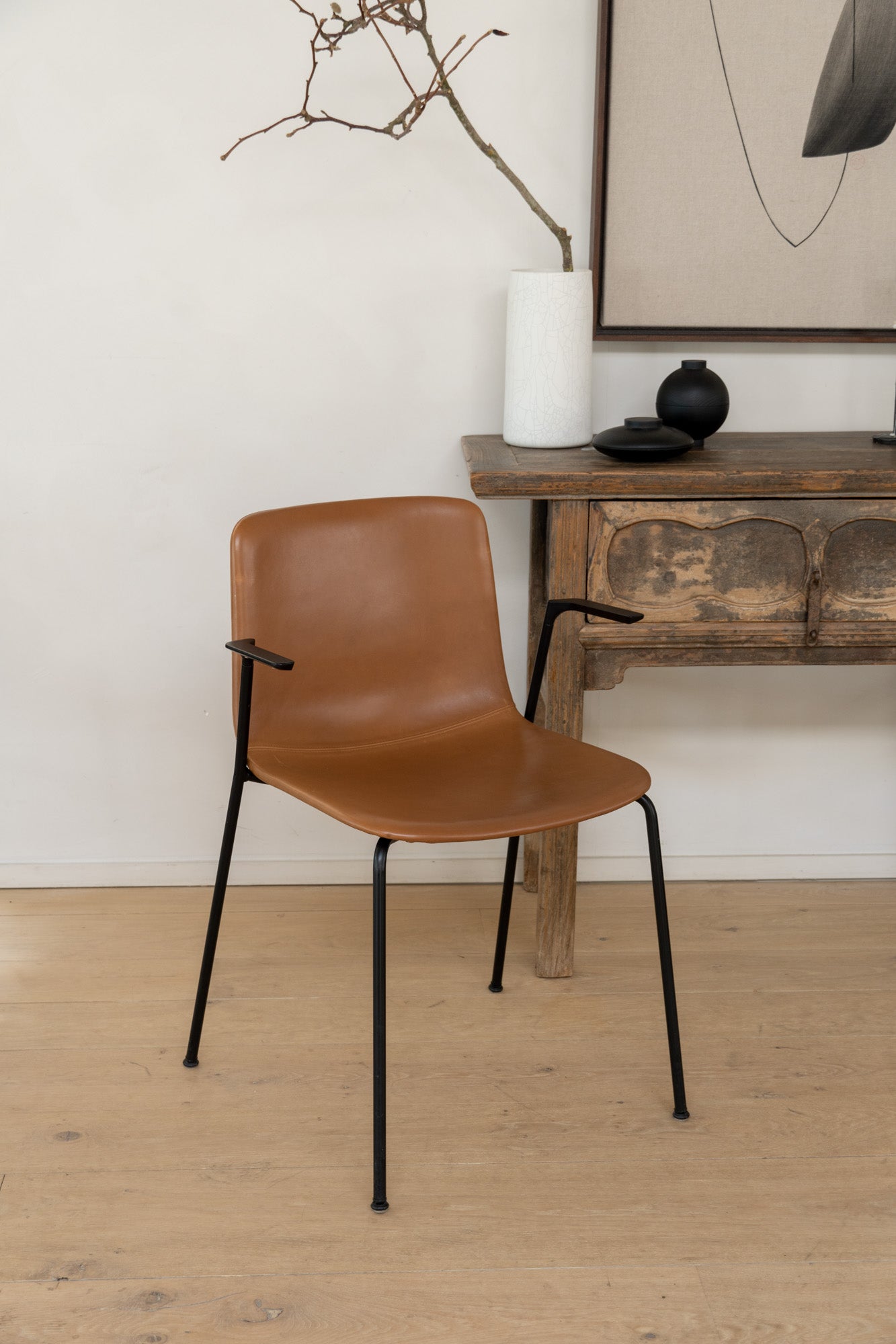 Fredericia Pato Chair - a sustainably designed chair with a black powder-coated frame and leather seating - Enter The Loft