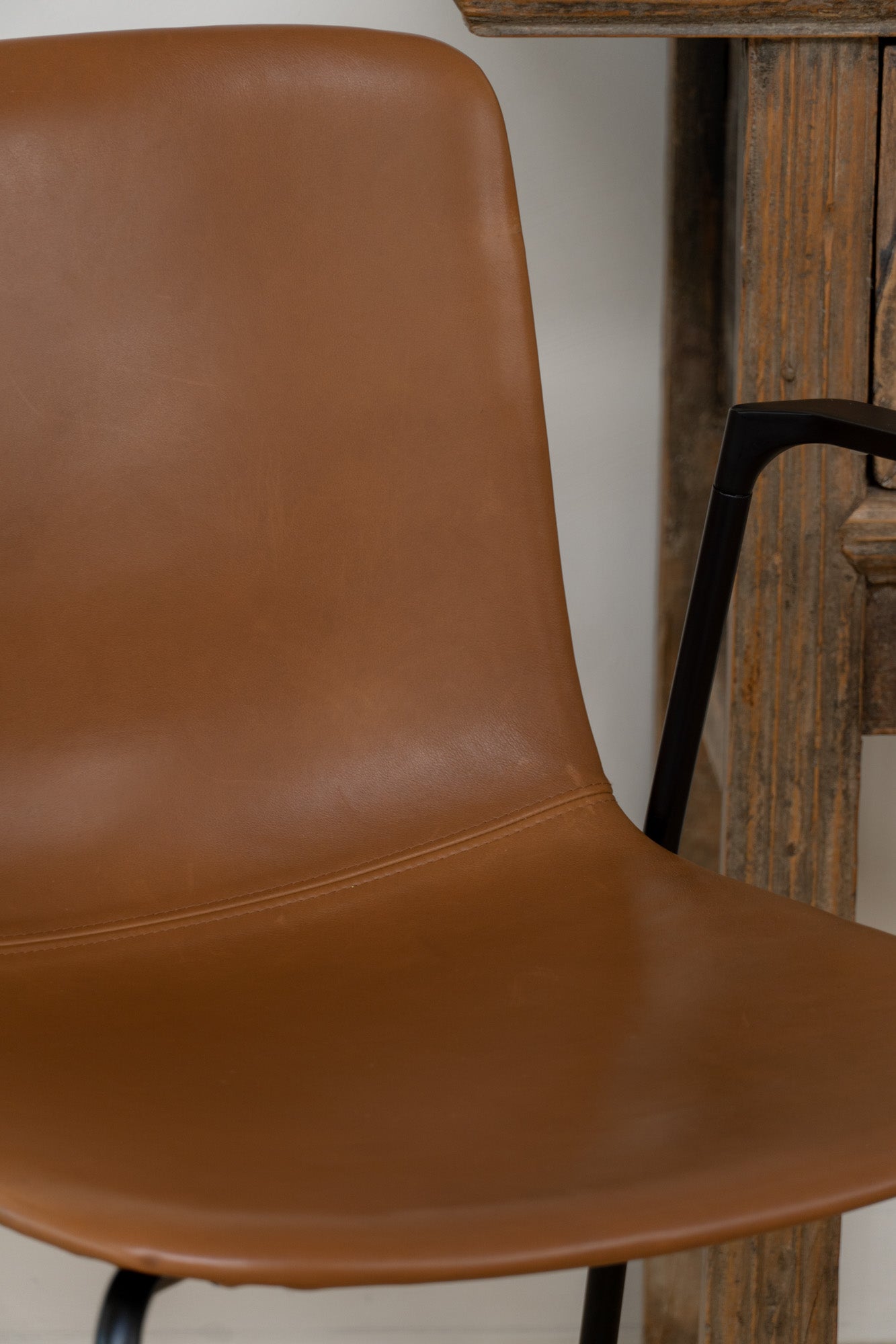Fredericia Pato Chair - a sustainably designed chair with a black powder-coated frame and leather seating - Enter The Loft