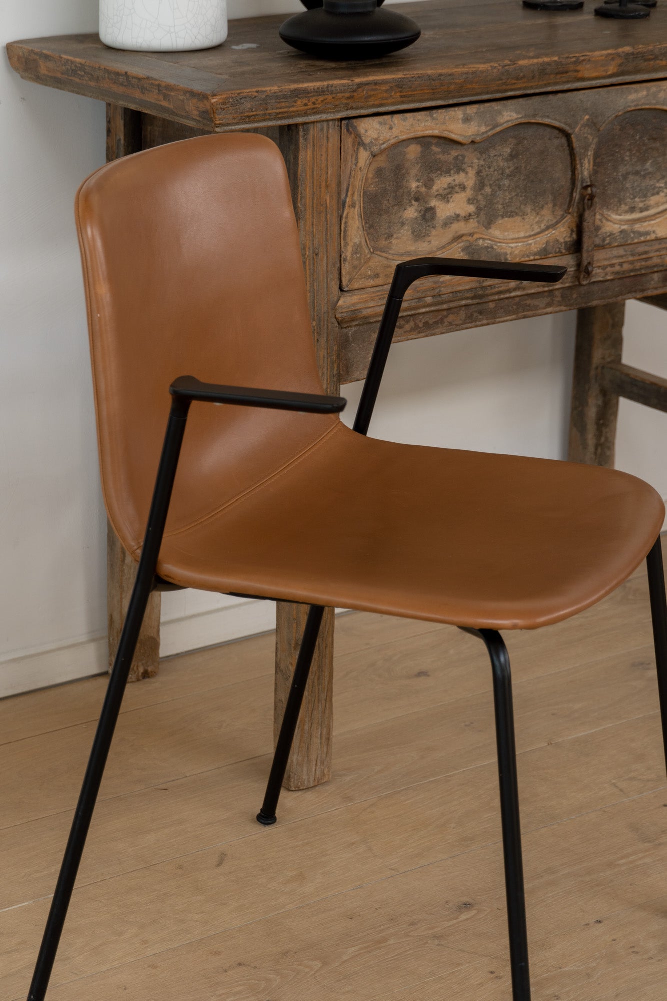 Fredericia Pato Chair - a sustainably designed chair with a black powder-coated frame and leather seating - Enter The Loft