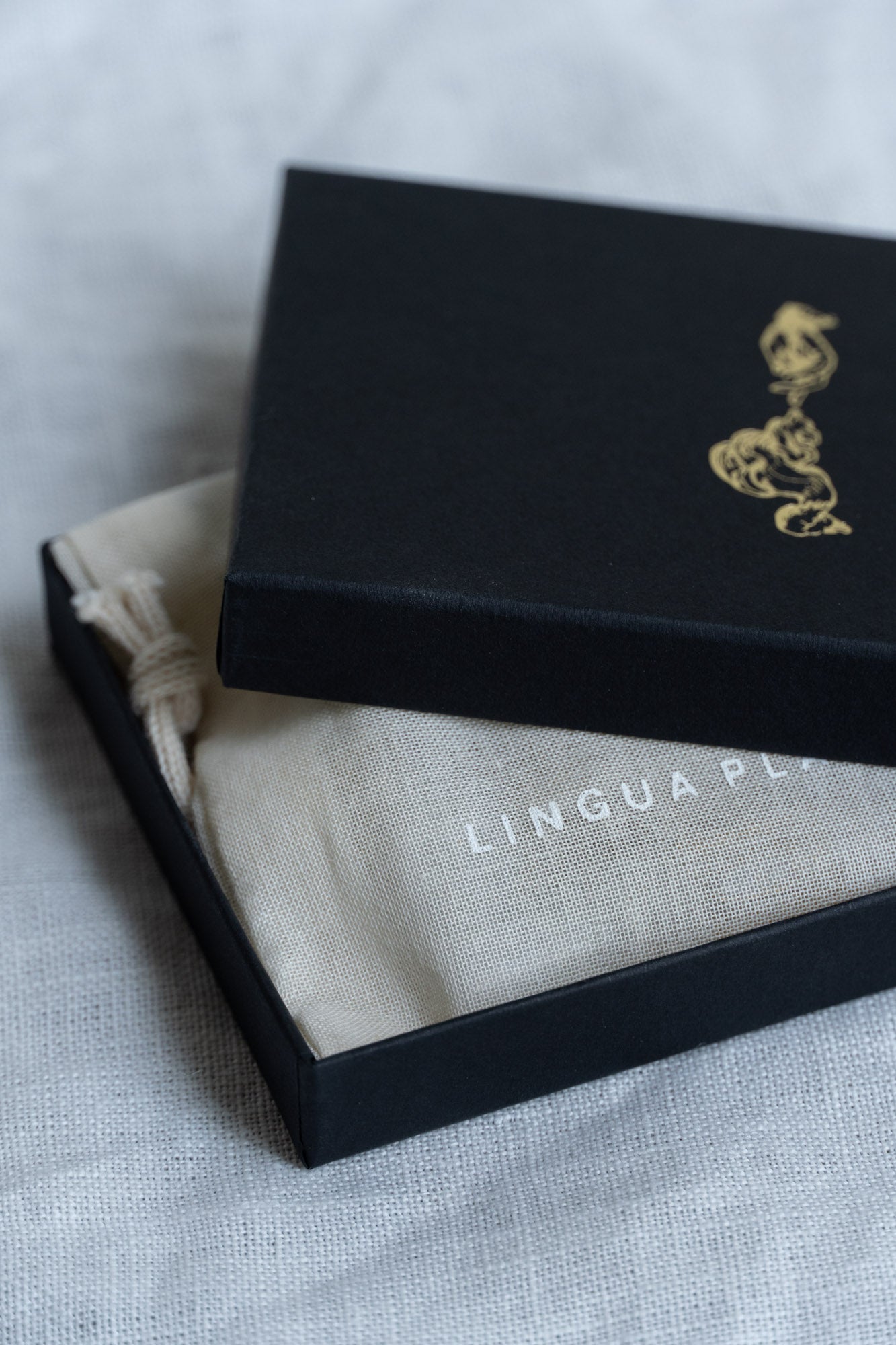 Gift box with linen bag packaging brand identity for the Discovery Kit Perfumes by Lingua Planta.
