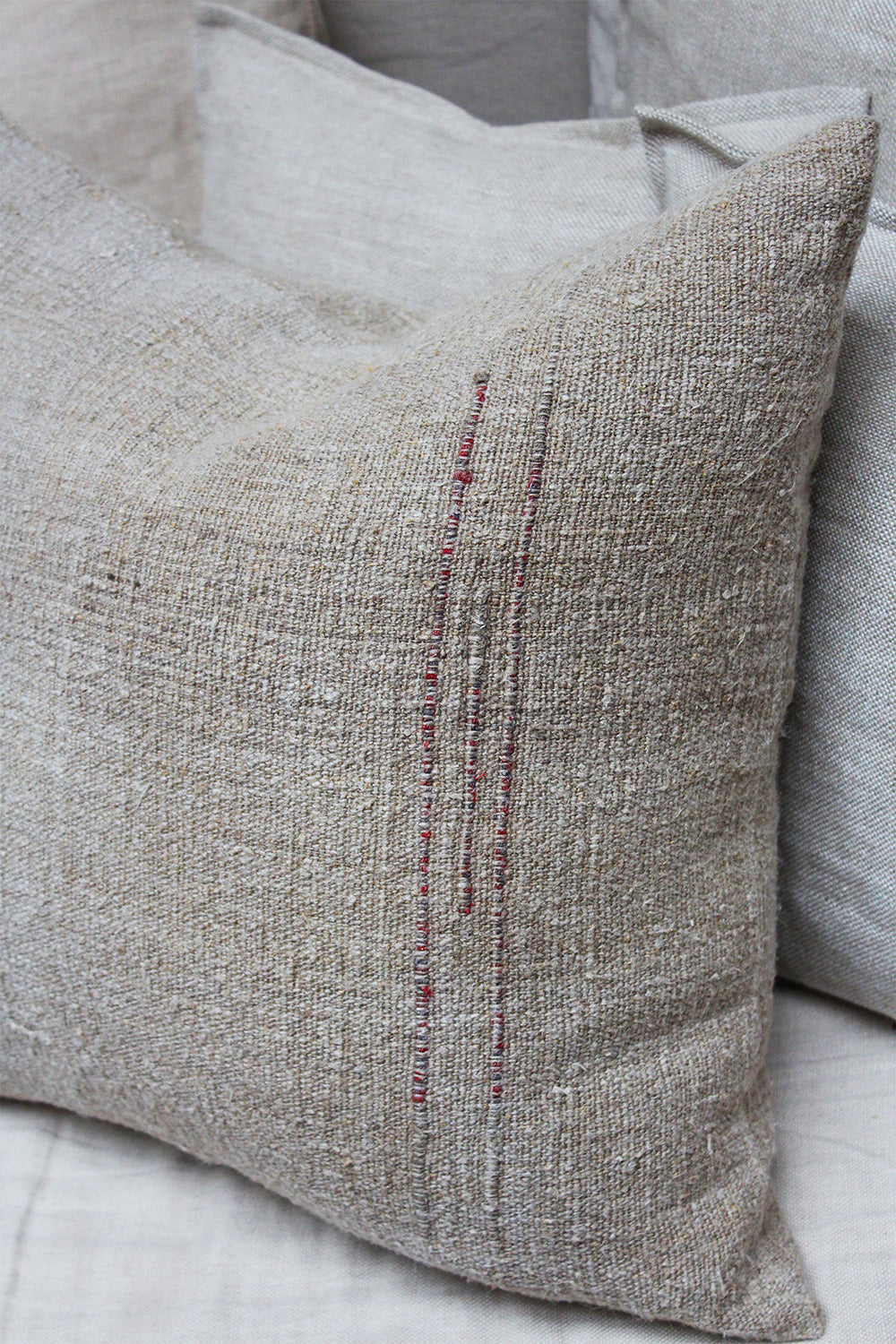 Close-up of the textures in the natural dyed linen cushions.