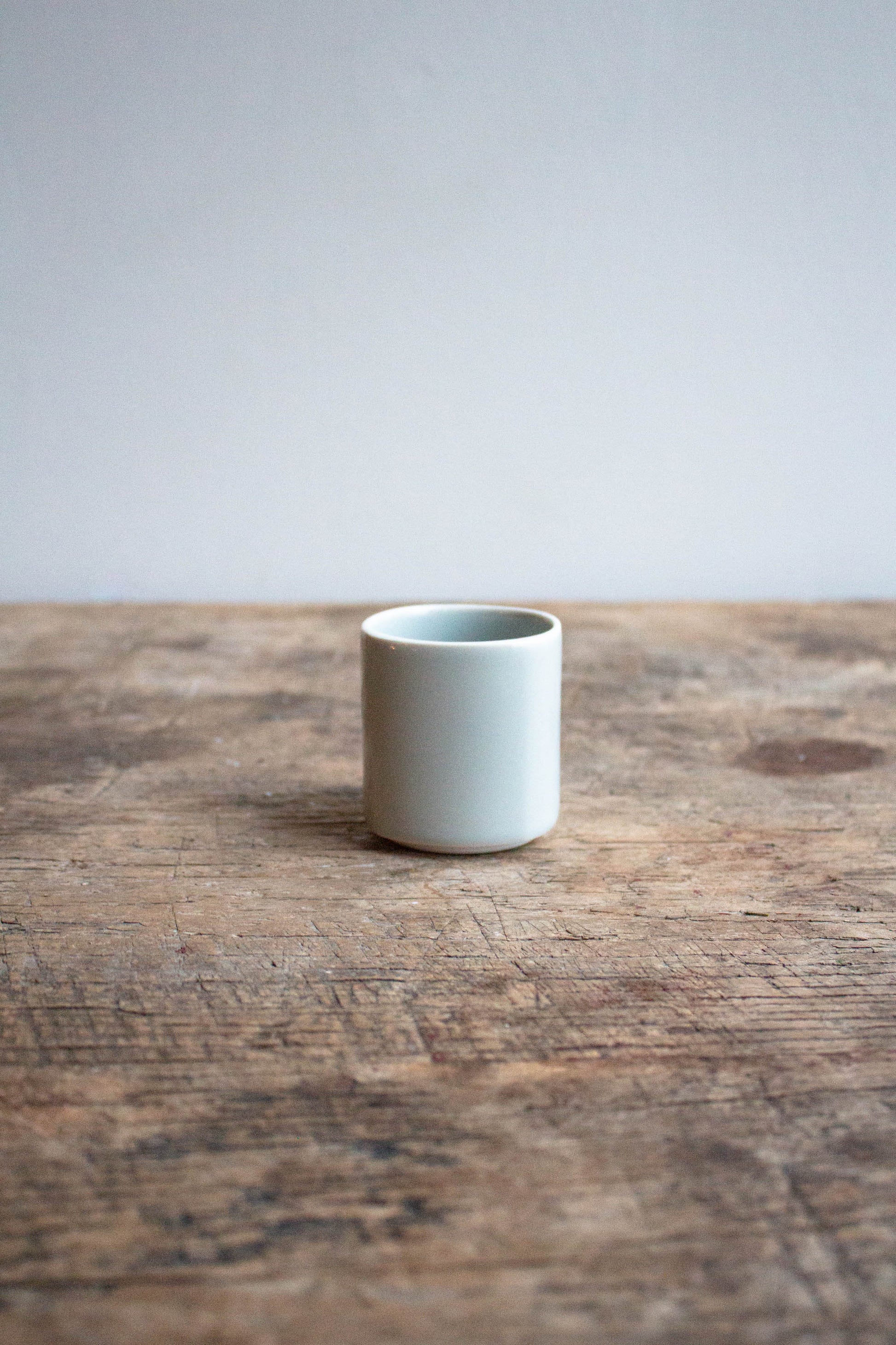 Tumbler Calque by Jars Ceramistes on wooden table.