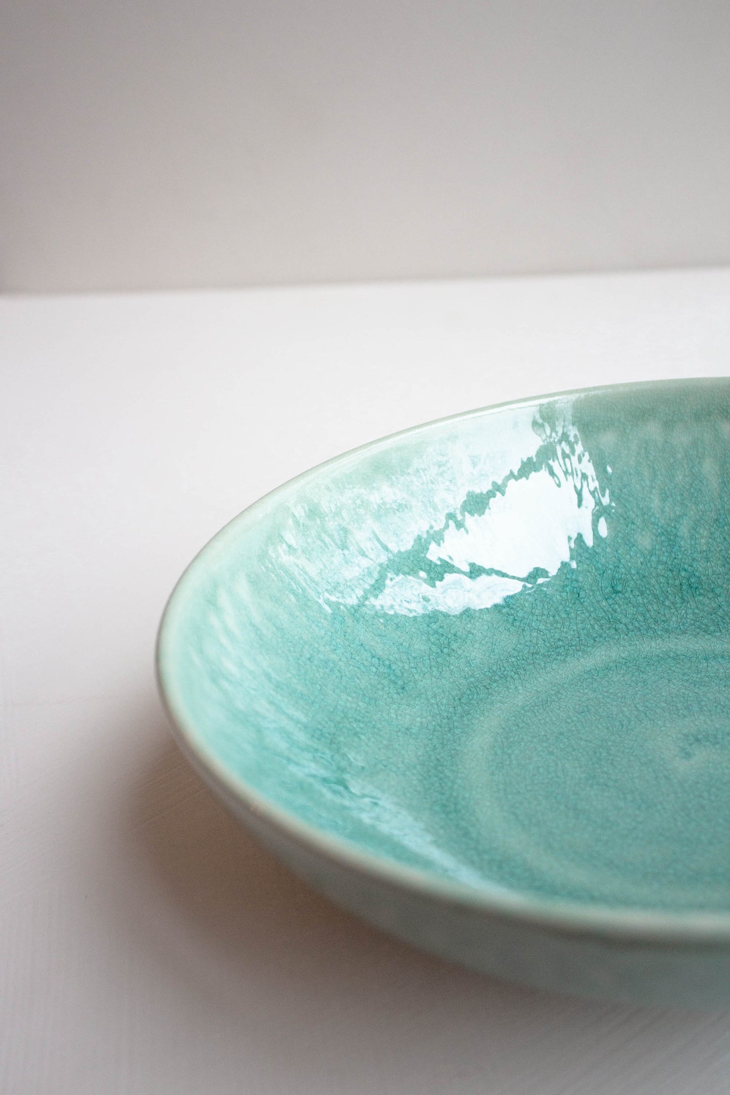 Close-up of the Tourron Deep Plate Celadon by Jars Ceramistes.