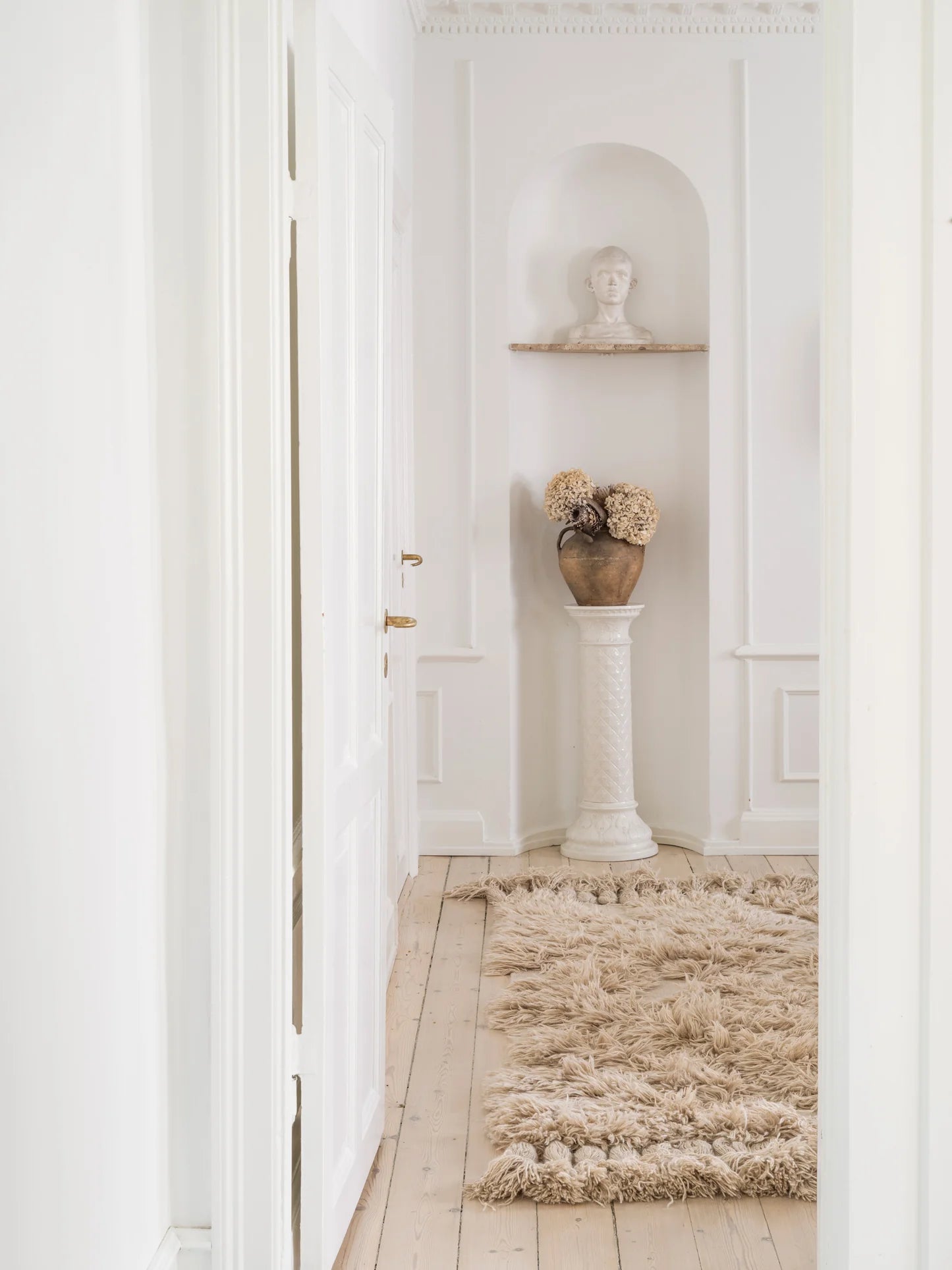 Handwoven high rug in white interior