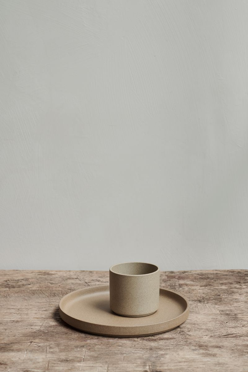 Hasami Porcelain Ceramic Japanese Stackable Plate and Coffee Mug Cup Clay on a rustic wooden table.