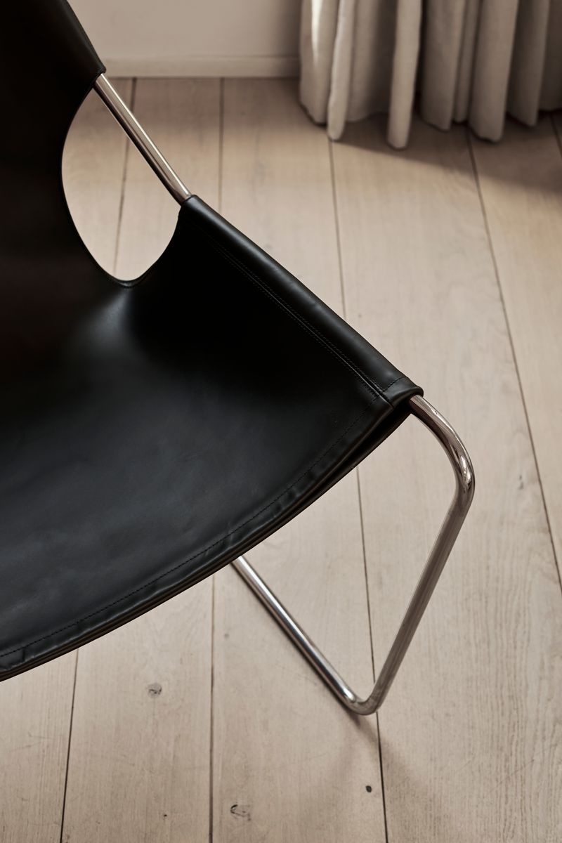 Details of the Stainless Steel Frame and Black Leather of the Paulistano Chair by Objekto.