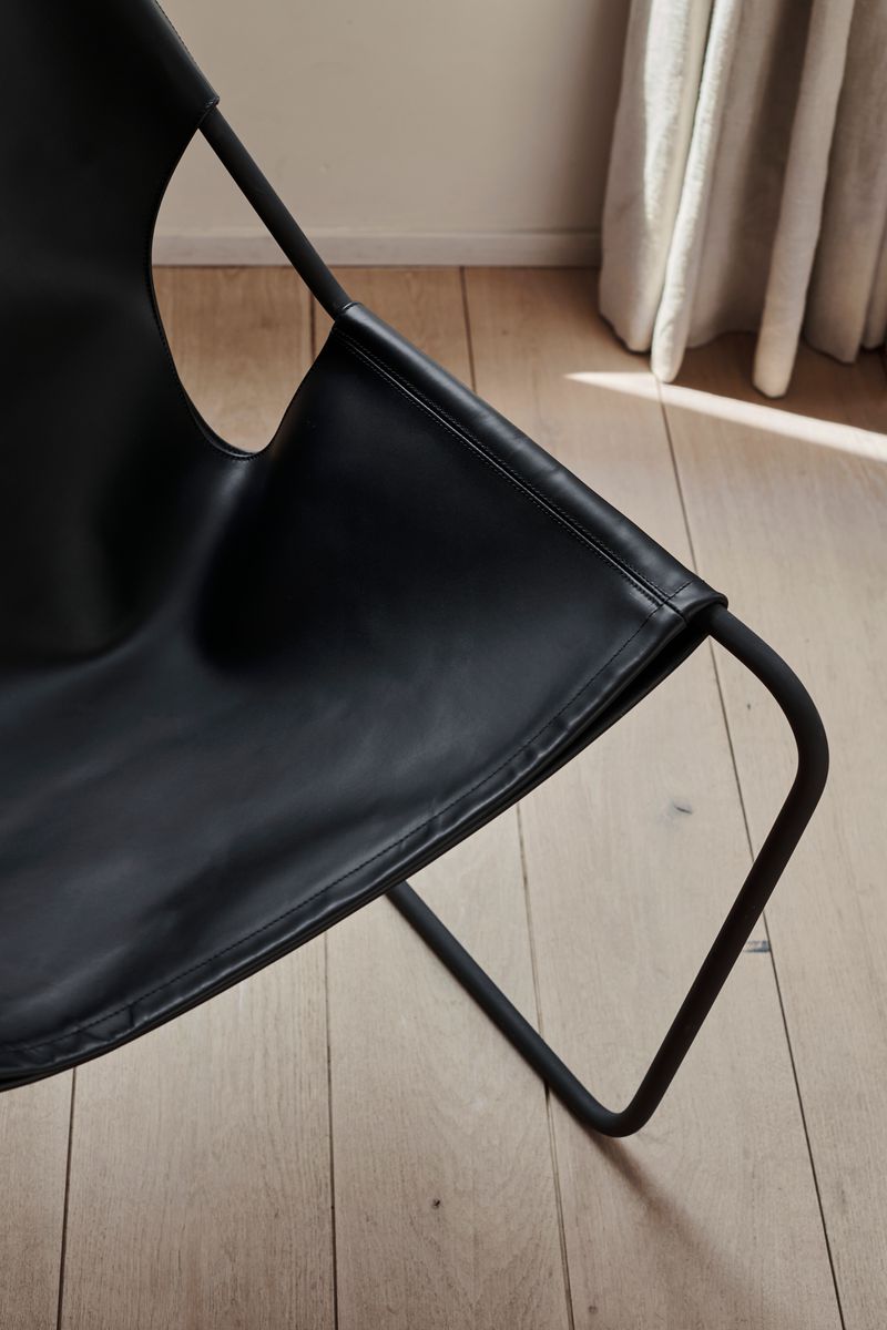 Details of the Paulistano Chair by Objekto. Made with a Phosphate Black Frame and Black leather seating.