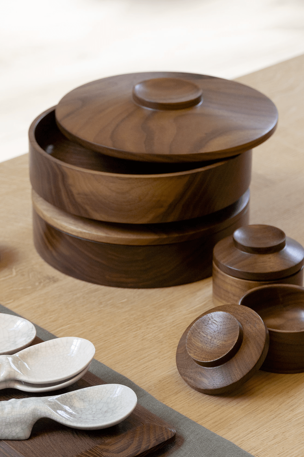 Repeat Stackable Cookie Jars by Het Houtlokaal - A set of dark walnut wood jars, hand-turned and modular. The stackable design allows for easy storage and a striking centrepiece.