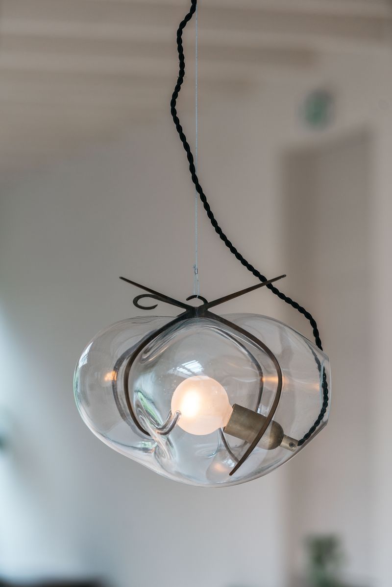 Exhale Pendant Lamp by WDSTCK. A hanging glass bubble with metal frame.