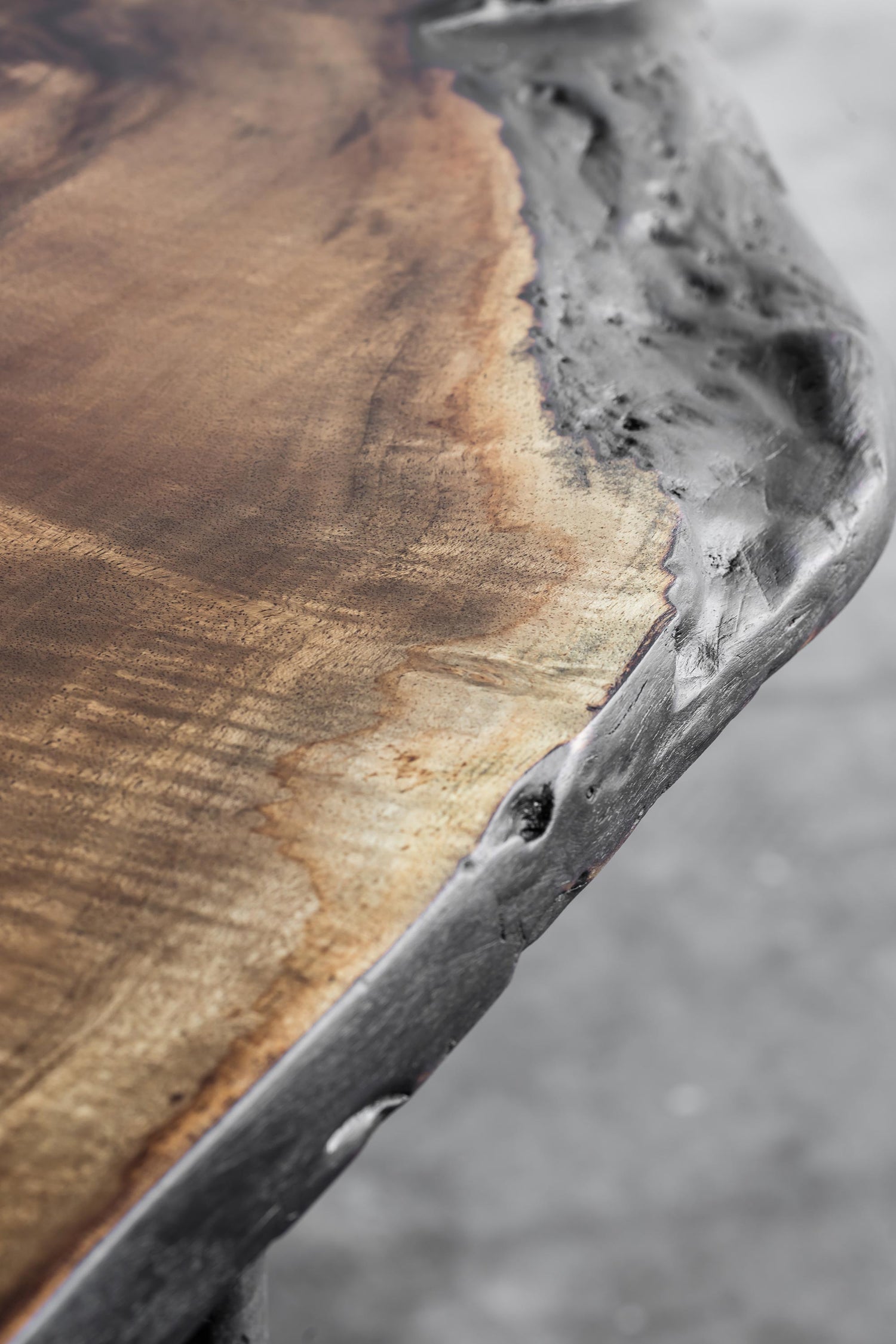 Close-up of the Heerenhuis Lars Zech Coffee Table - Made from long textured thick walnut wood.