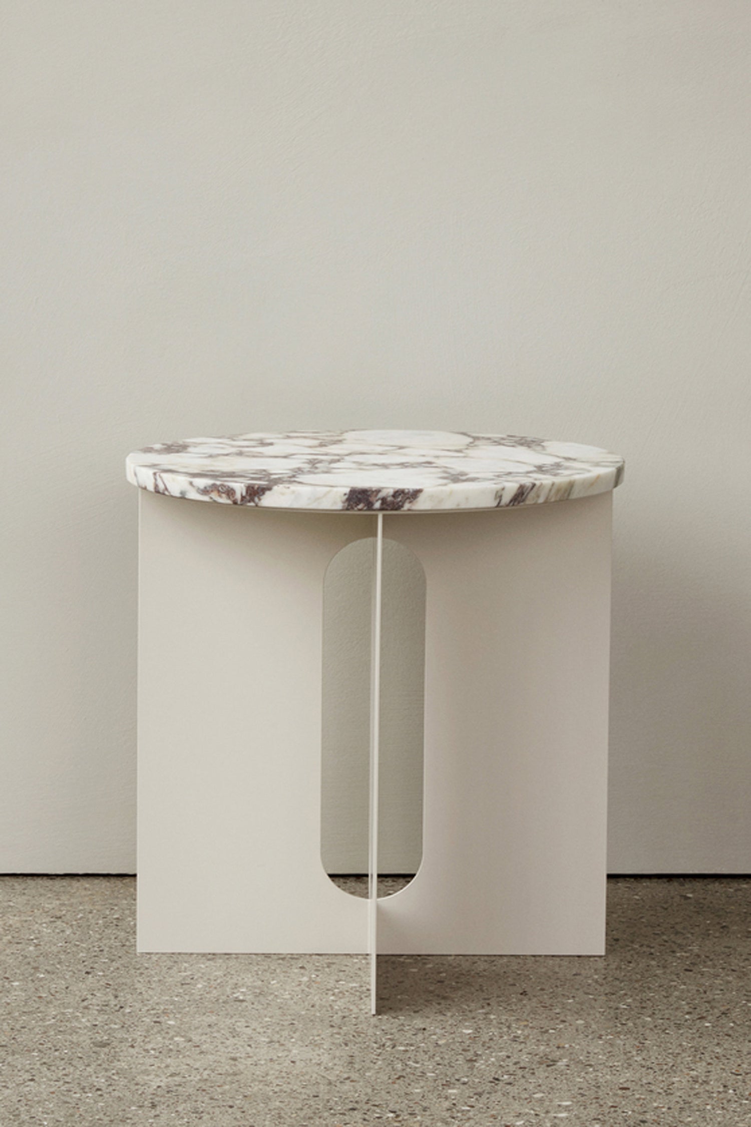 Menu Androgyne Side Table with Ivory Steel base and marble table top.