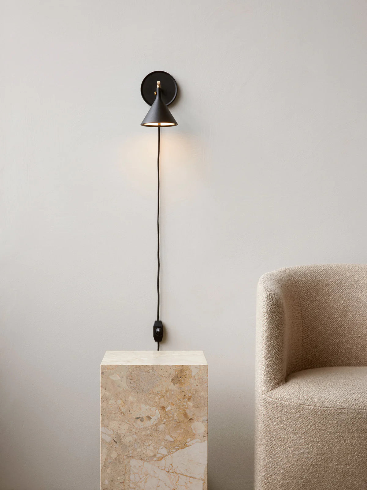 Cast Sconce Wall Lamp Diffuser, Dimmer by Menu in Black set in a light and neutral interior at Enter The Loft.