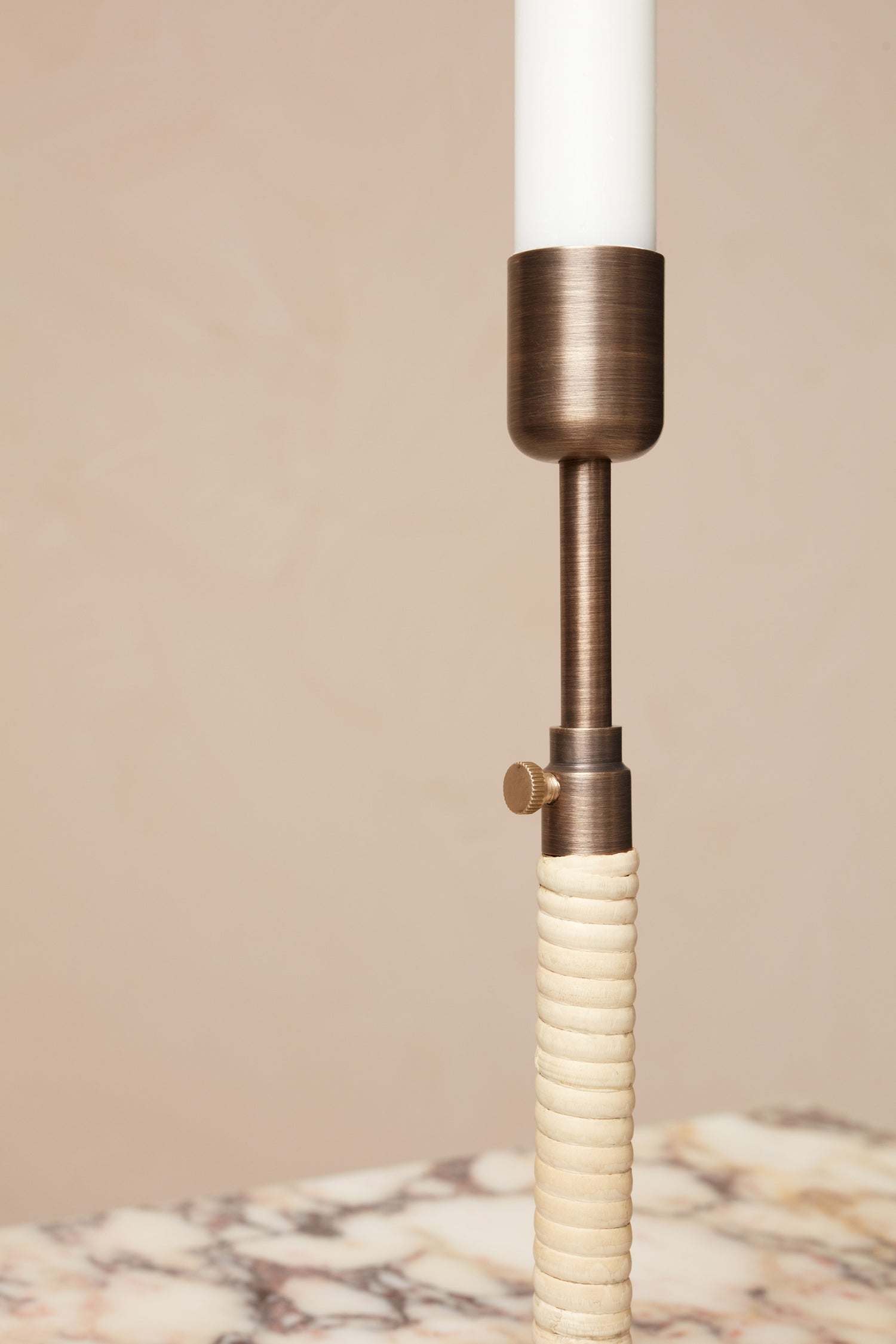 Close-up of the Duca Candleholder, Bronzed Brass by Menu.