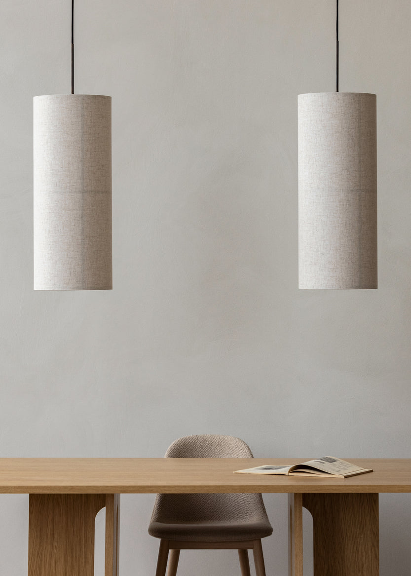 Two Hashira Pendant Lamps hanging above table.