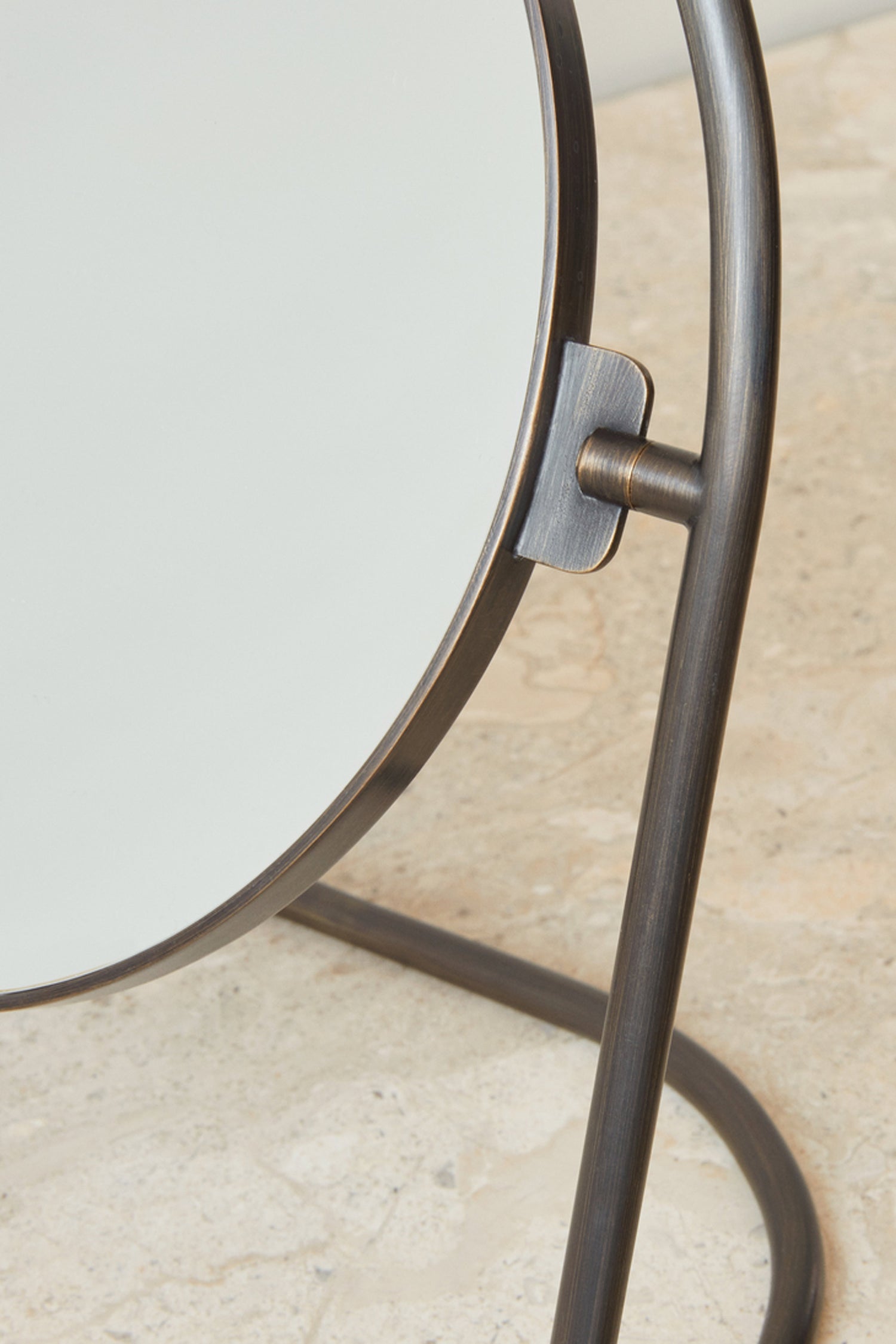 Close-up of the Nimbus Table Mirror by Menu in Bronzed Brass.