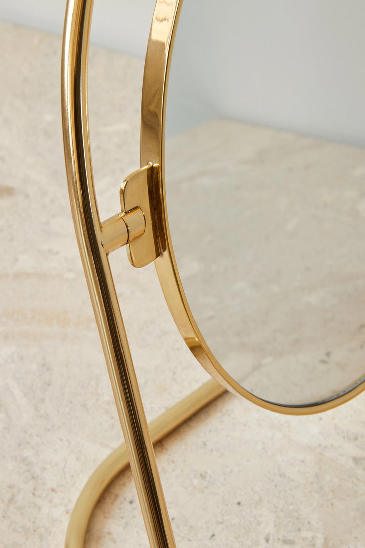 Close-up of the Nimbus Table Mirror by Menu in Polished Brass.
