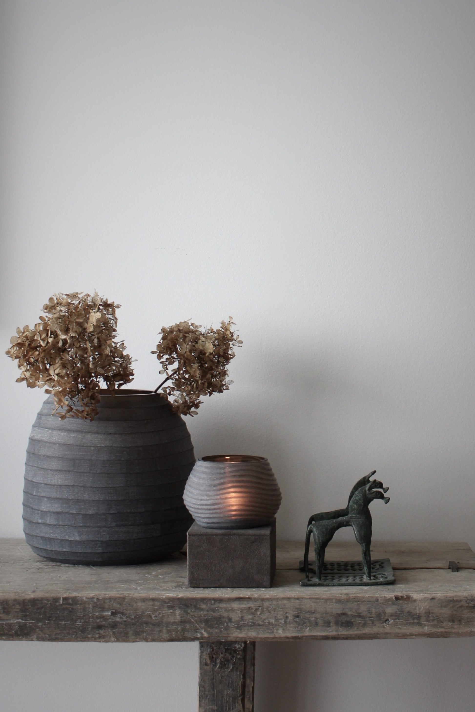 Organic Vase Smoke by Nordstjerne set on wooden table at Enter The Loft.