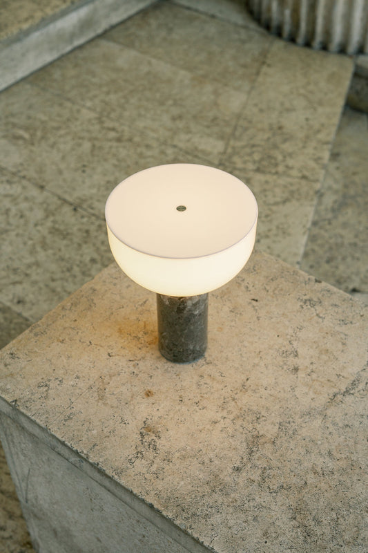 Kizu Portable Lamp Gris du Marais by New Works with light turned on.