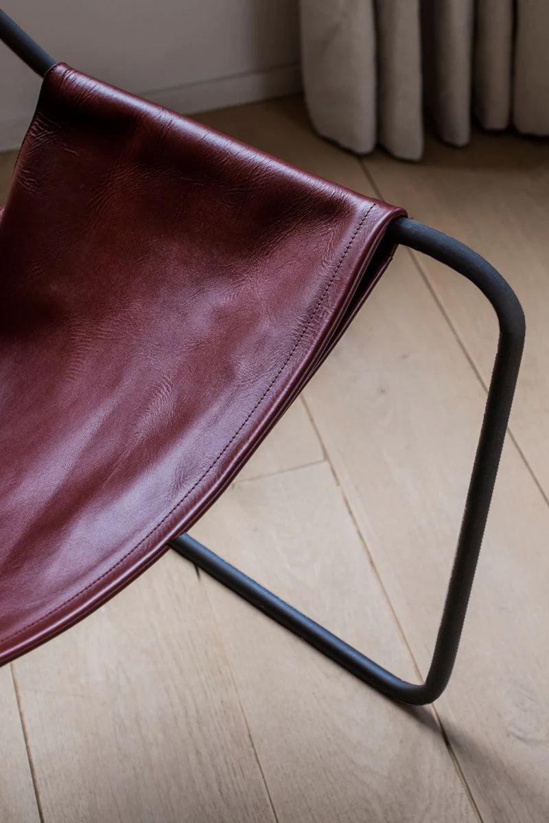 Details of the Paulistano Chair by Objekto. Made with a Phosphate Black Frame and Cognac leather seating.