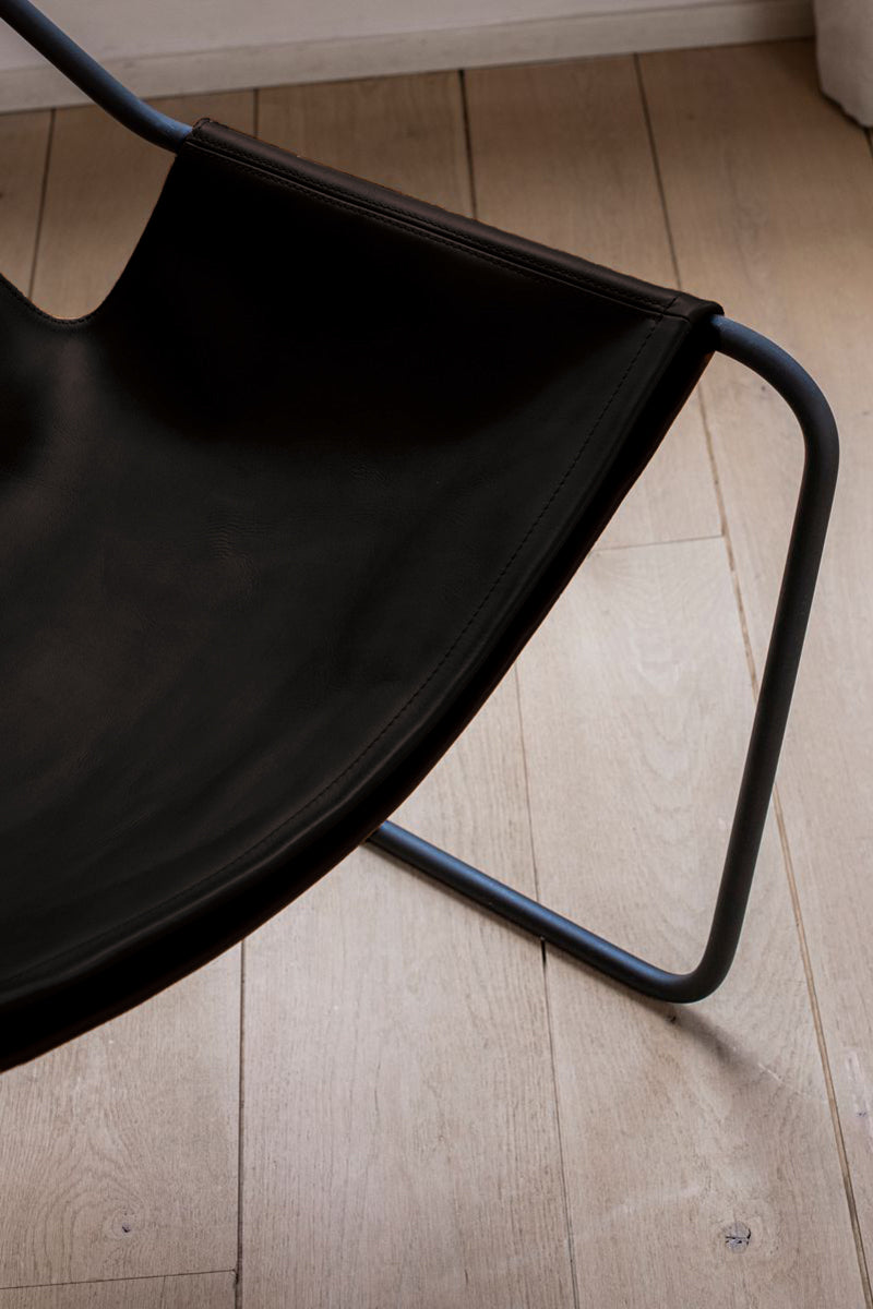 Details of the Paulistano Chair by Objekto. Made with a Phosphate Black Frame and Macassar leather seating.