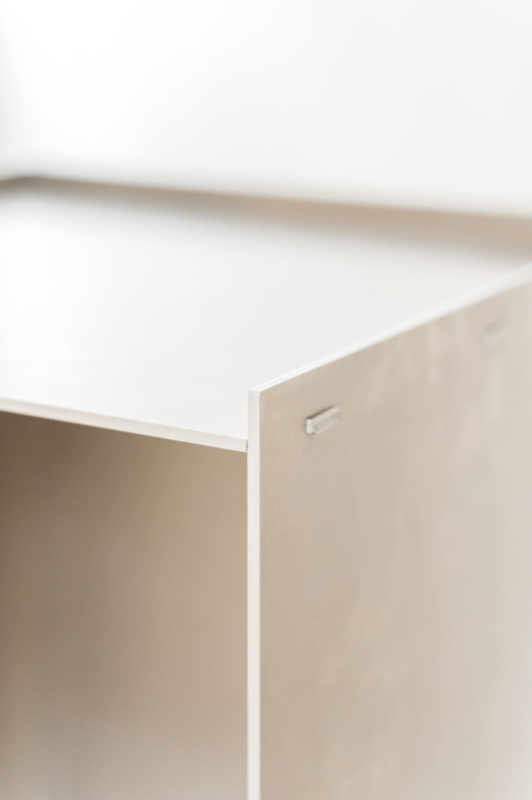 Close-up of the Rivet Box Side Table, highlighting its sturdy construction and intricate details. A celebration of craftsmanship and the raw beauty of untreated aluminum.