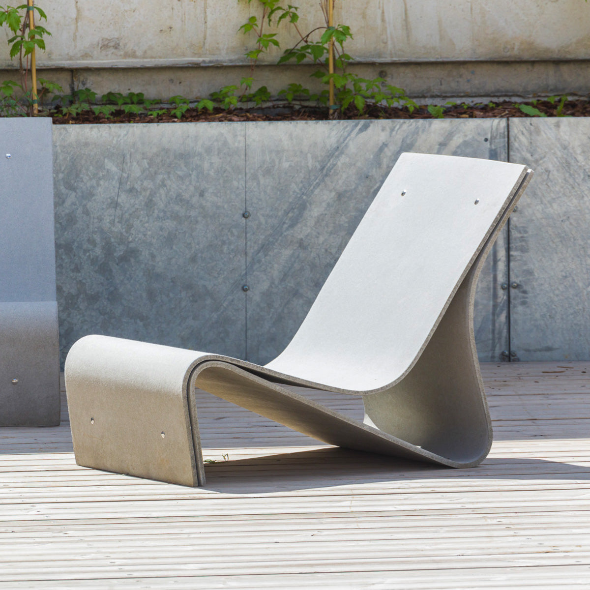 Close-up of the Sponeck Chair by Julia von Sponeck, showing off the ergonomically sophisticated shape of this modern lounge chair.