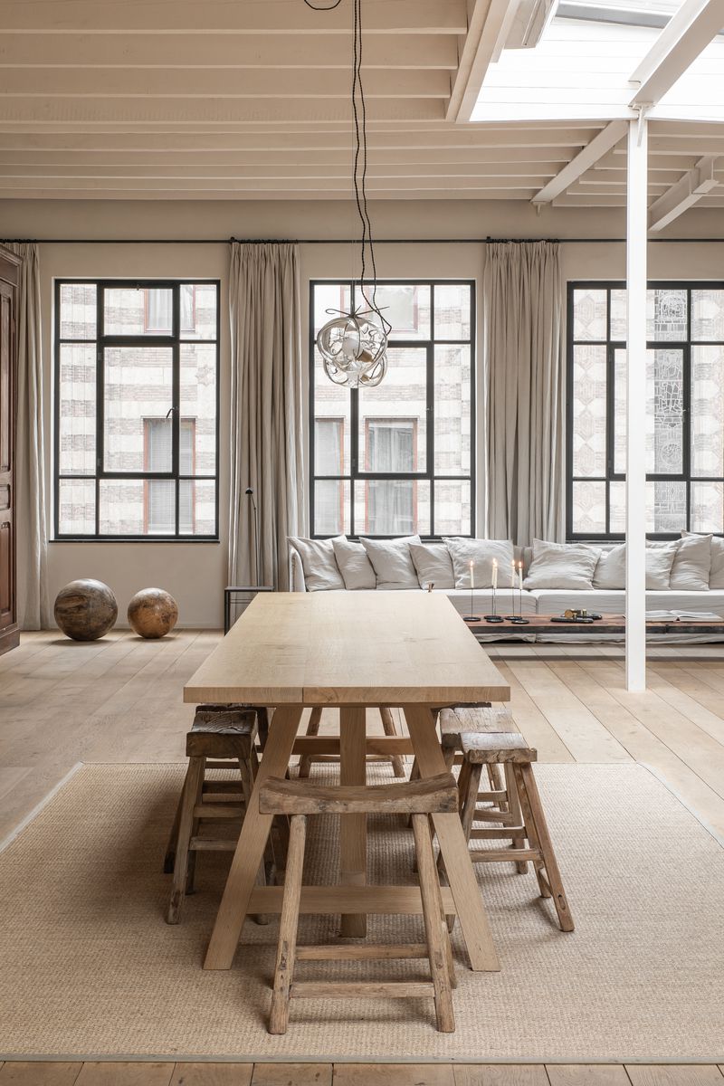 The handmade Trestle Table by Heerenhuis set in a light and lofty open interior design living and dining space at Enter The Loft.