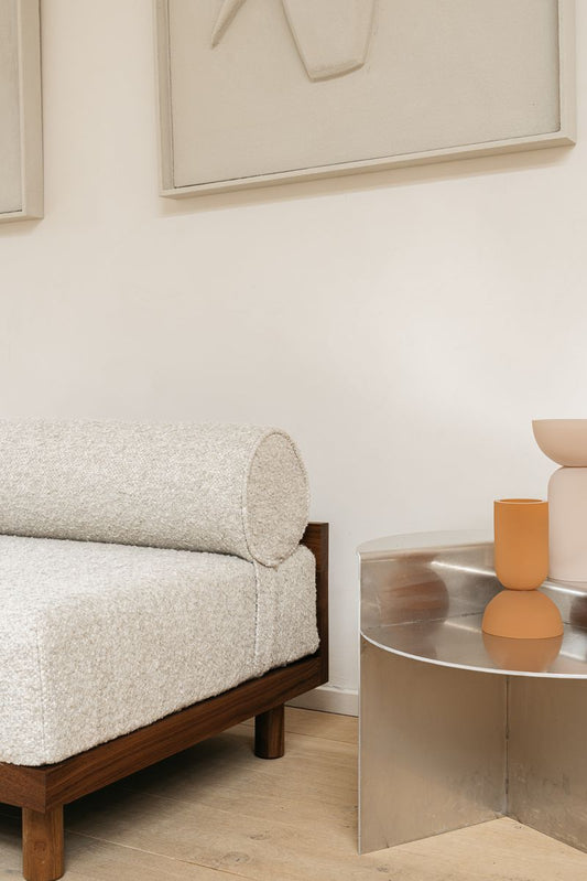 daybed seat with steel side table and design objects