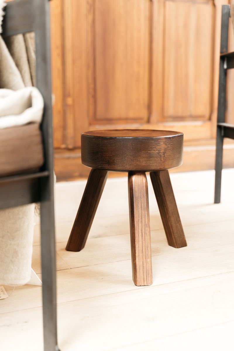 Close-up of the AML stool by FRAMA, showcasing its smooth surface and detailed craftsmanship. Adds a touch of sophistication to any space.