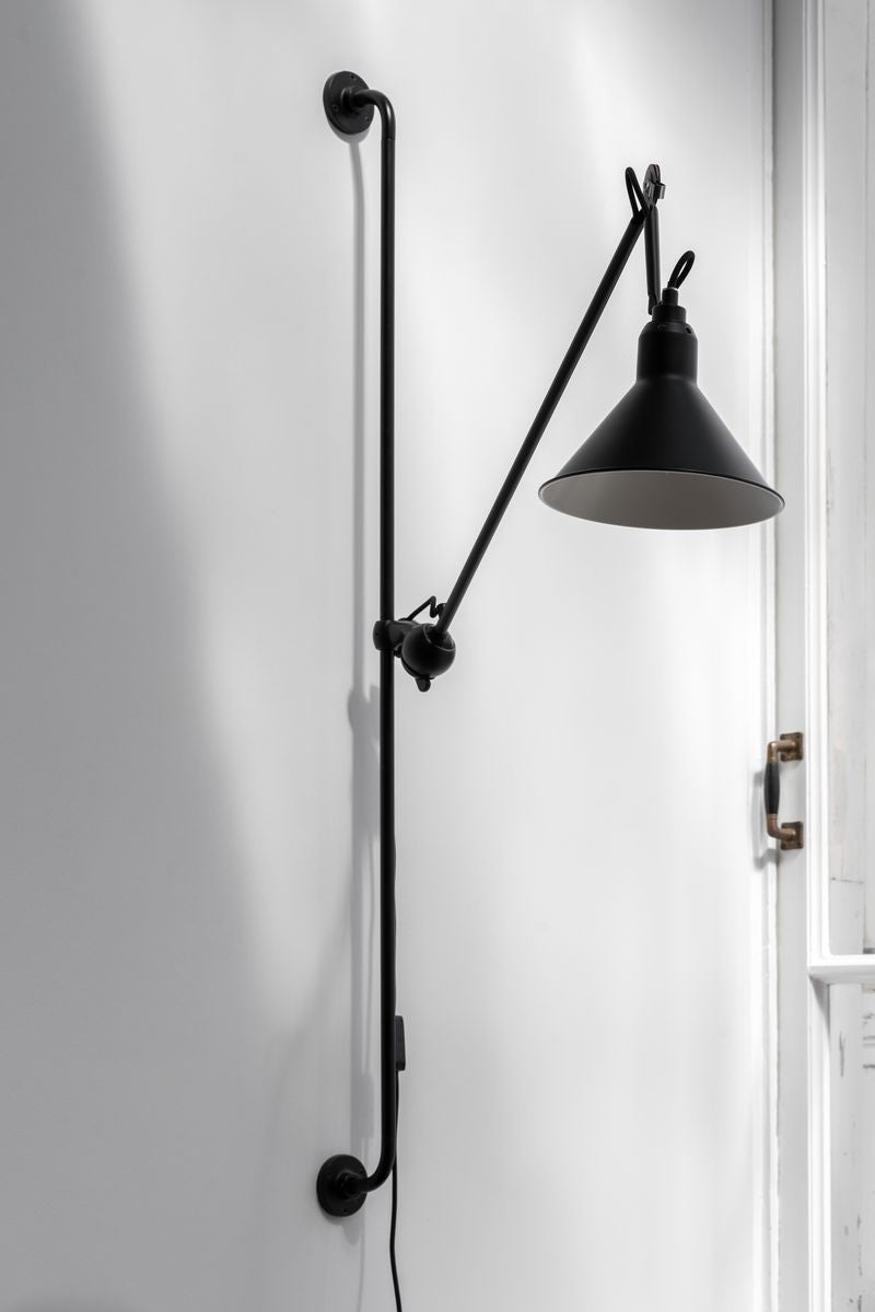 Lampe Gras N°214 wall lamp with adjustable arm and shade. Perfect for enhancing the ambiance and functionality of any space.