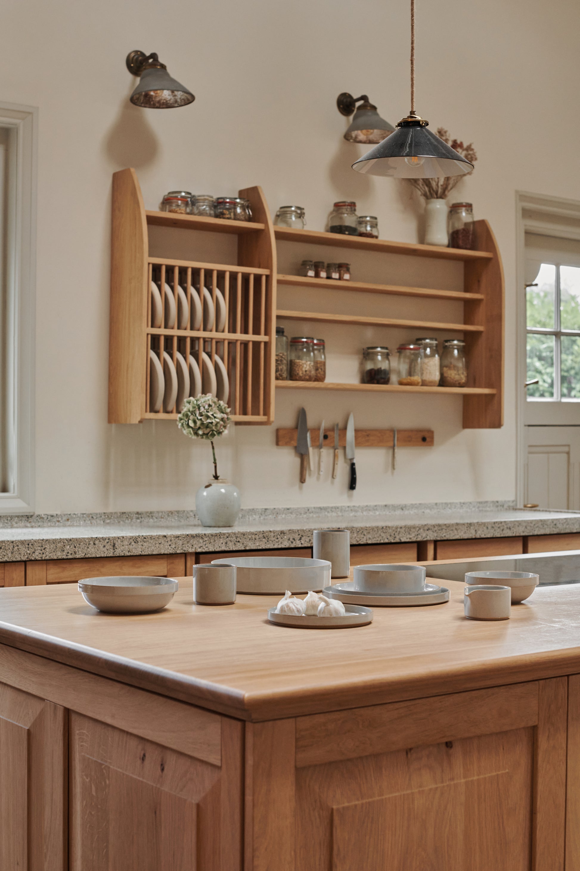 The Hasami Porcelain collection is displayed in a wooden panelled kitchen interior. A beautiful setting for this grey ceramic Japanese-style design tableware.