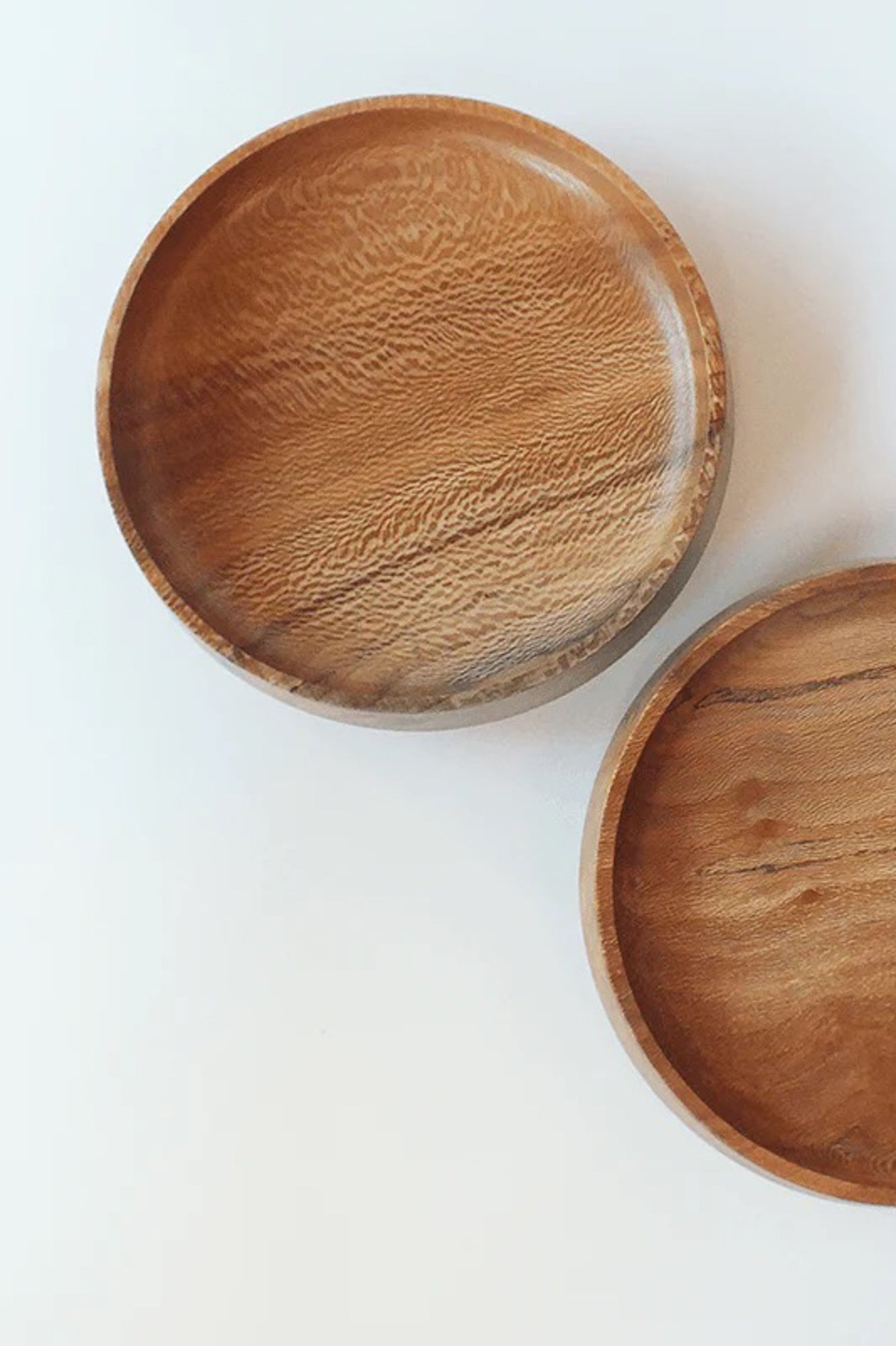 Little Bowl Sycamore Wood displayed on a table or countertop, adding a touch of organic elegance to the dining experience. Each piece is made from old city trees by local artisans in The Netherlands.